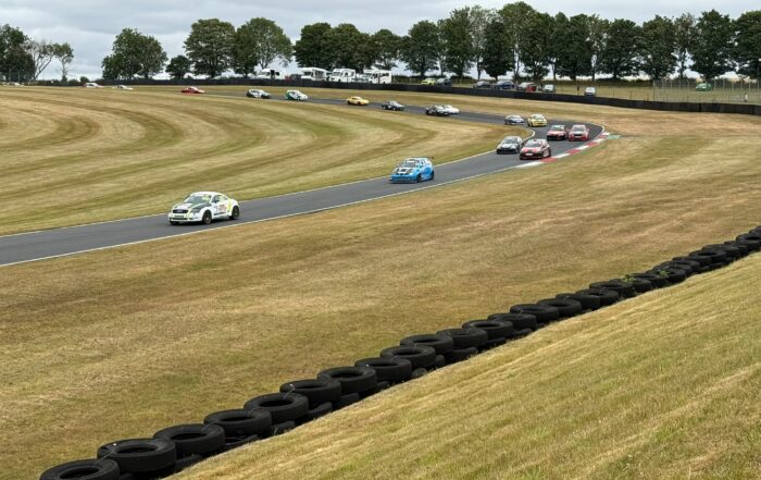 Norman leads the charge on the exit of Charlies on Lap 1 having taken the lead from the 2nd row